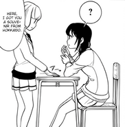 Ucchi giving Yuri a souvenir