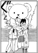 Uchi pulls the costumed bear's arms together to bring herself in contact with Tomoko.