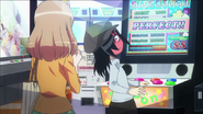 Tomoko gets a perfect score on an arcade game.