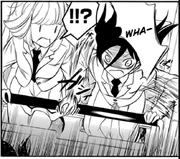 Uchi reacts to Tomoko clutching her hand.