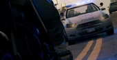 El coche de policía en persecución.