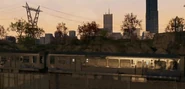 A badly maintained train in a poor district.