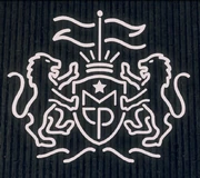 The stylised crest found on buildings.
