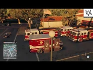 An ambulance parked near a Fire Truck