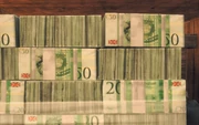 Stacks of pound banknotes, still bearing the old Union Jack.