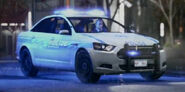 A police variant of the Cavale with its lights on.