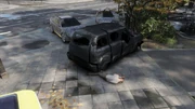 The crashed taxi and dead body.