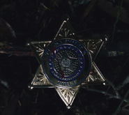 Chief Judd Crawford badge with blood