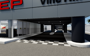 A general view of another entrance to the Car & Motorcycles Dealership.