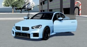 The BMW M2 with its doors open.