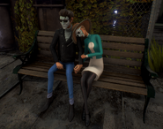 A Wellie couple cuddling on a bench.