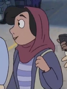 A Muslim woman with dark brown hair, dark skin, and is often seen wearing a red hijab. She is a student at California University.