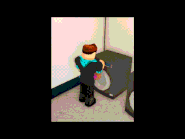 Tom putting clothes into the washing machine