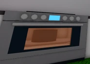 A Birthday Cake baking in an oven.