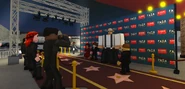 Paparazzi taking photos of actors Gloria Stage, Gunnar Teardown, and Brandon Bright at the premiere.