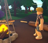A player roasting bread at the Campsite.