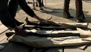 The Model 1873 seen in the bundle at the beginning of the Mariposa Saloon heist ("The Original")