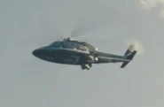 Helicopter carrying James Delos