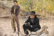 The Man in Black and Lawrence at the Blood Arroyo, over the dead rattlesnake