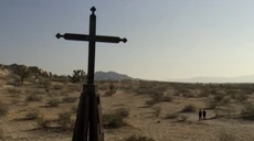 Ford and Bernard look at what remains of the buried church