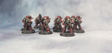 A squad of Brothers of the Blood in relic MkIII 'Iron' pattern battle-plate of the 12th ("The Bloody Twelfth") Assault Company.