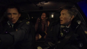 Sheena transforms into a werewolf in the back of the police car