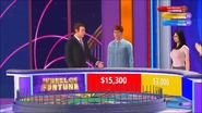 Pat's stand-in congratulating the red contestant after winning a round