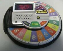 Irwin-Toy-2009-Wheel-Of-Fortune-Electronic-Handheld.jpg