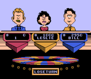 (UH-OH !!!) The yellow contestant frowns after she hits a Lose a Turn....