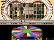 Another game in progress and the Wheel (the background matches the color of Vanna's dresses)
