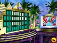Game in progress on Hawaii stage & wheel spinning on video wall with overhead camera