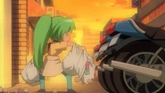 Chibi Mion tears her bag on a motorbike.