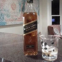 Johnnie Walker Black Label Whiskeypedia Wiki Fandom Unlike many artisan scotches, johnnie walker offerings are blended whiskies that come in several levels of quality indicated by coloured labels. johnnie walker black label