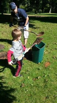 Brandon Ray Watson and son Aviar doing course work installing new pin placement for Vollrath Park hole #3.