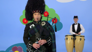 Anthony playing the bagpipes and Michael playing the conga drums