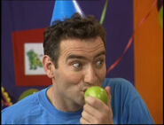 Anthony eating apple in "The Party"