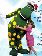 Dorothy the Dinosaur hugging a little girl. (As seen on the back cover for the Go To Sleep Jeff! CD.)