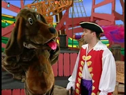 Captain Feathersword and Wags barking each other