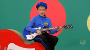 Little Anthony playing the blue Maton electric guitar