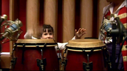 Zoe playing the conga drums