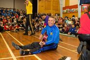 Anthony playing Murray's red Maton acoustic guitar in New Zealand