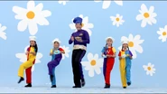 Lachy and The Wiggles' Coloured Dancers holding Crunchy Munchy Honey Cakes