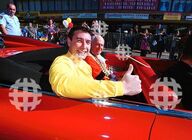 Greg in the red Volkswagen car