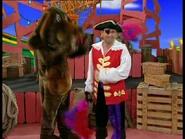 Wags blowing Captain Feathersword down