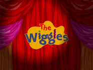 The Wiggles' logo on a curtain