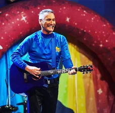 Anthony playing mini blue guitar