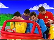 The Wiggles putting their seatbelts on