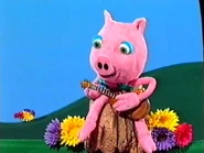 Mr. Pig playing the guitar and oinking