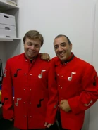 Alex Keller and Steve Pace in jackets while backstage at a promotional concert for the iTunes app.