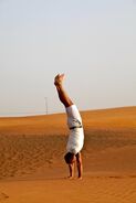 Anthony doing a handstand in Dubai